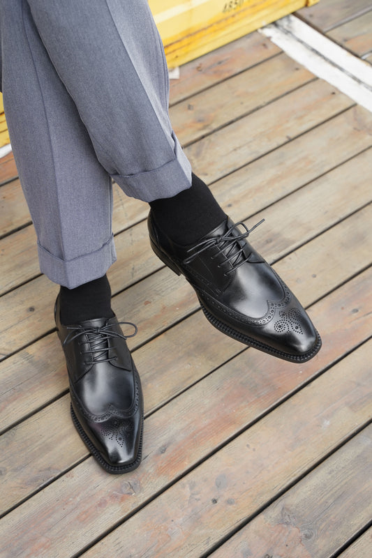 Black Elegance Brogue Derby with premium leather finish and intricate brogue detailing, tailored for the modern gentleman.