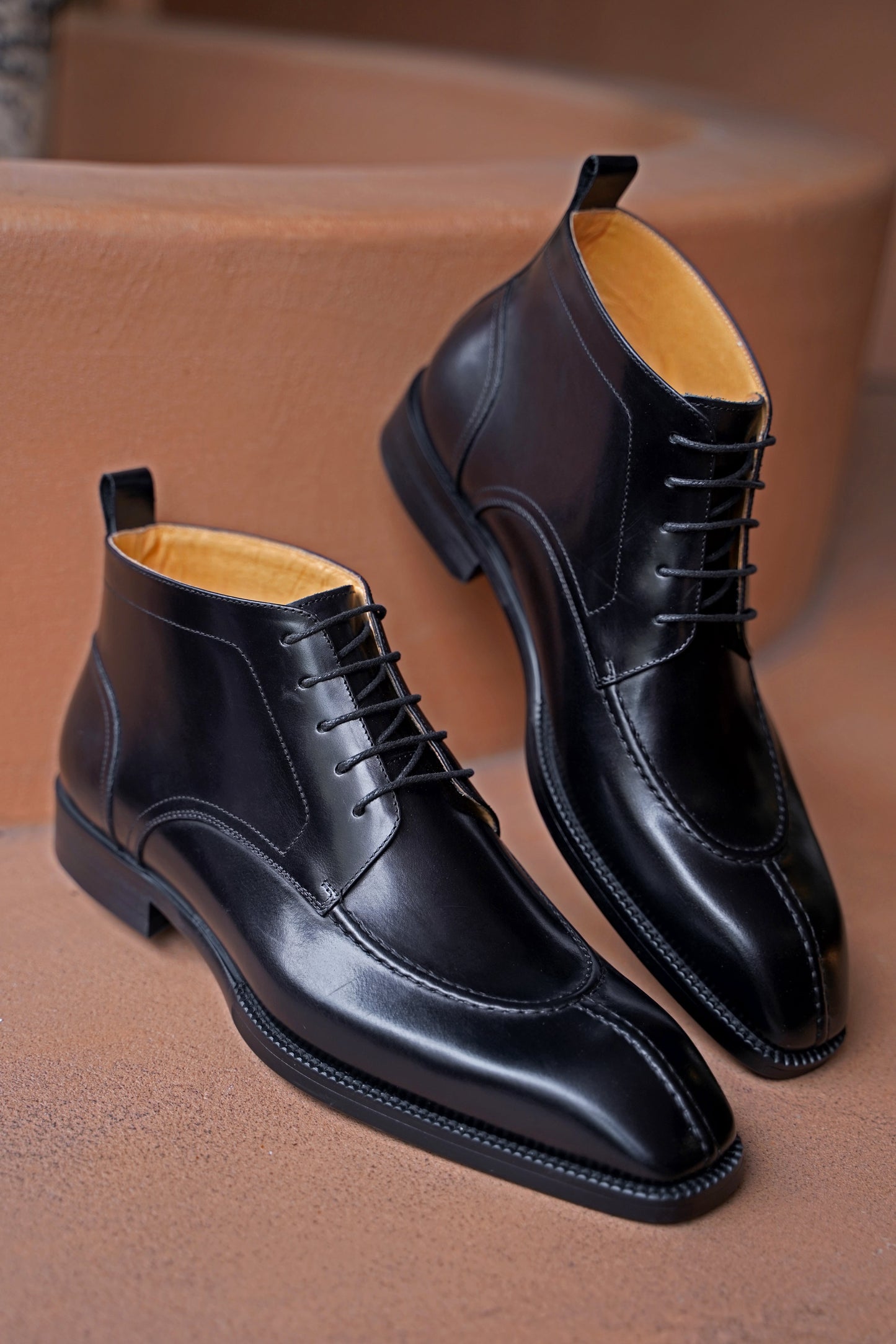 Midnight Noir Lace-Up Boots in sleek black leather, designed for formal occasions and business wear.