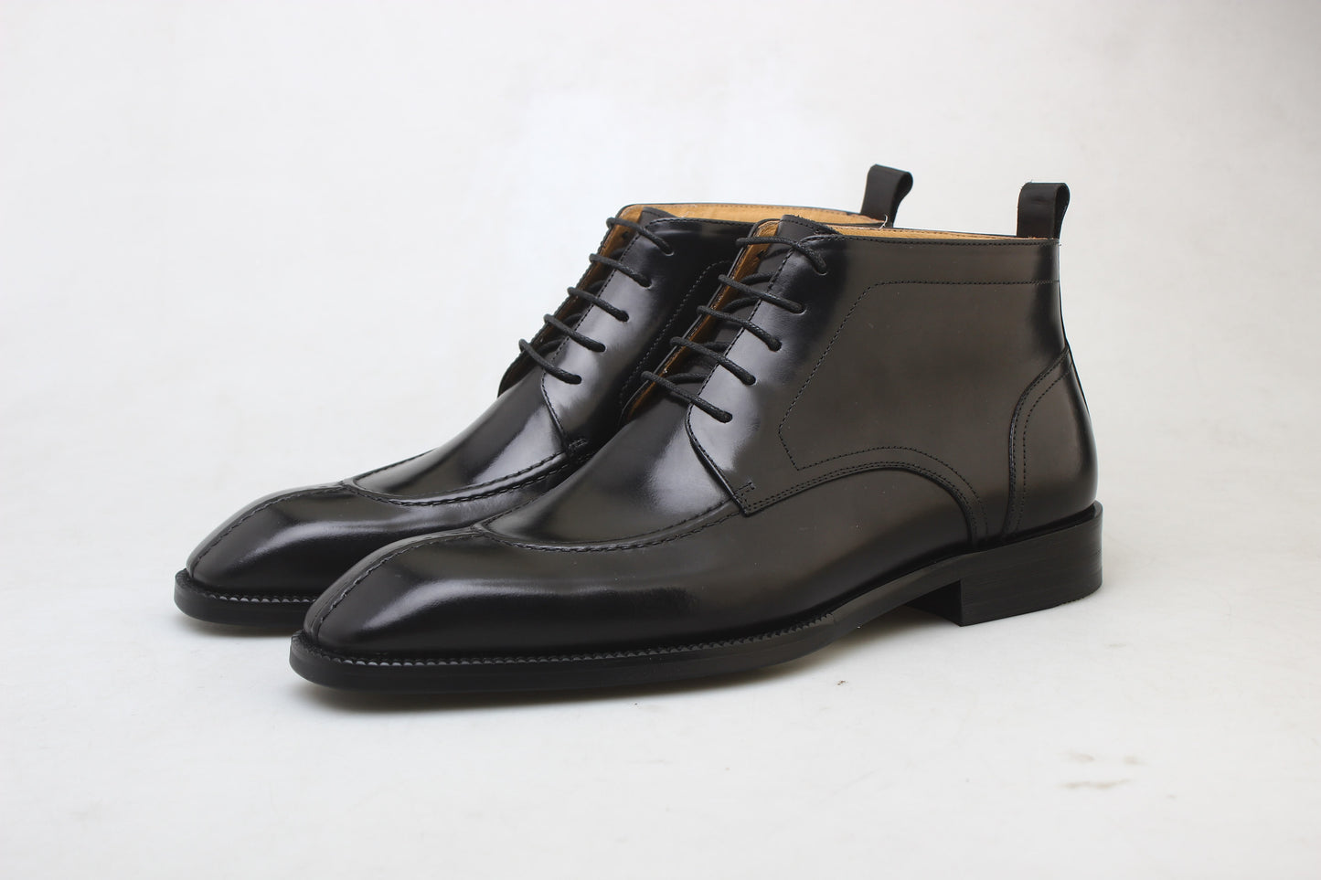 Midnight Noir Lace-Up Boots in sleek black leather, designed for formal occasions and business wear.