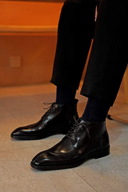 Midnight Noir Lace-Up Boots in sleek black leather, designed for formal occasions and business wear.