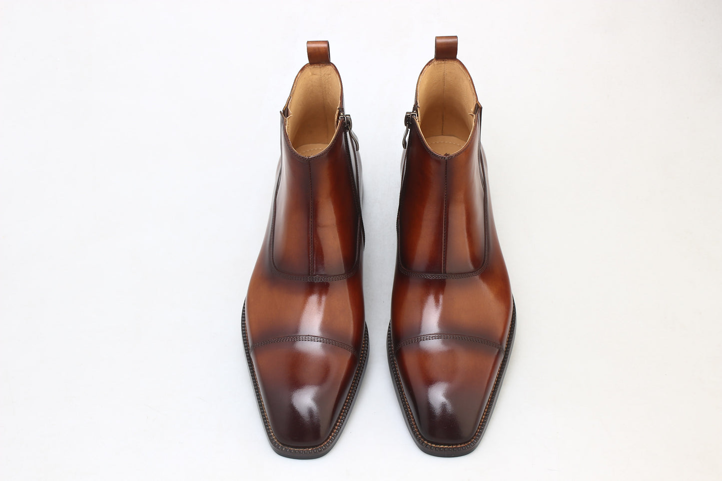 Chestnut Chelsea Boots in chestnut brown leather, featuring a seamless slip-on design for formal and casual wear.