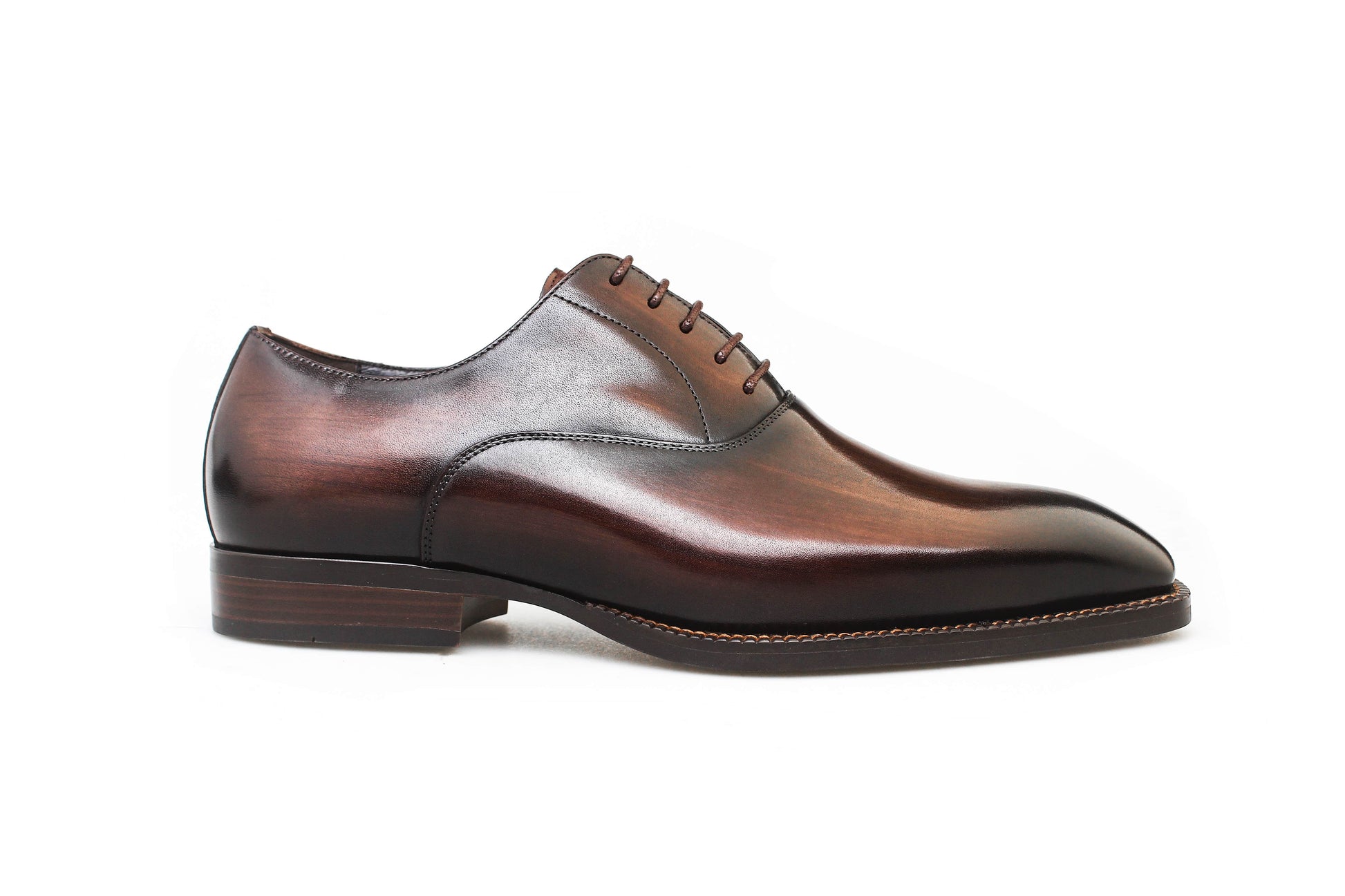 Espresso Elegance Oxford with sleek closed lacing, crafted from premium brown leather for formal events.