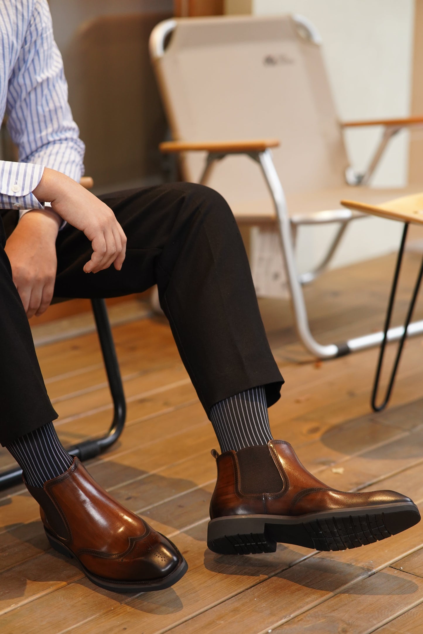 Cognac Brogue Spectator Chelsea Boots in polished brown leather with intricate brogue detailing for a refined look.