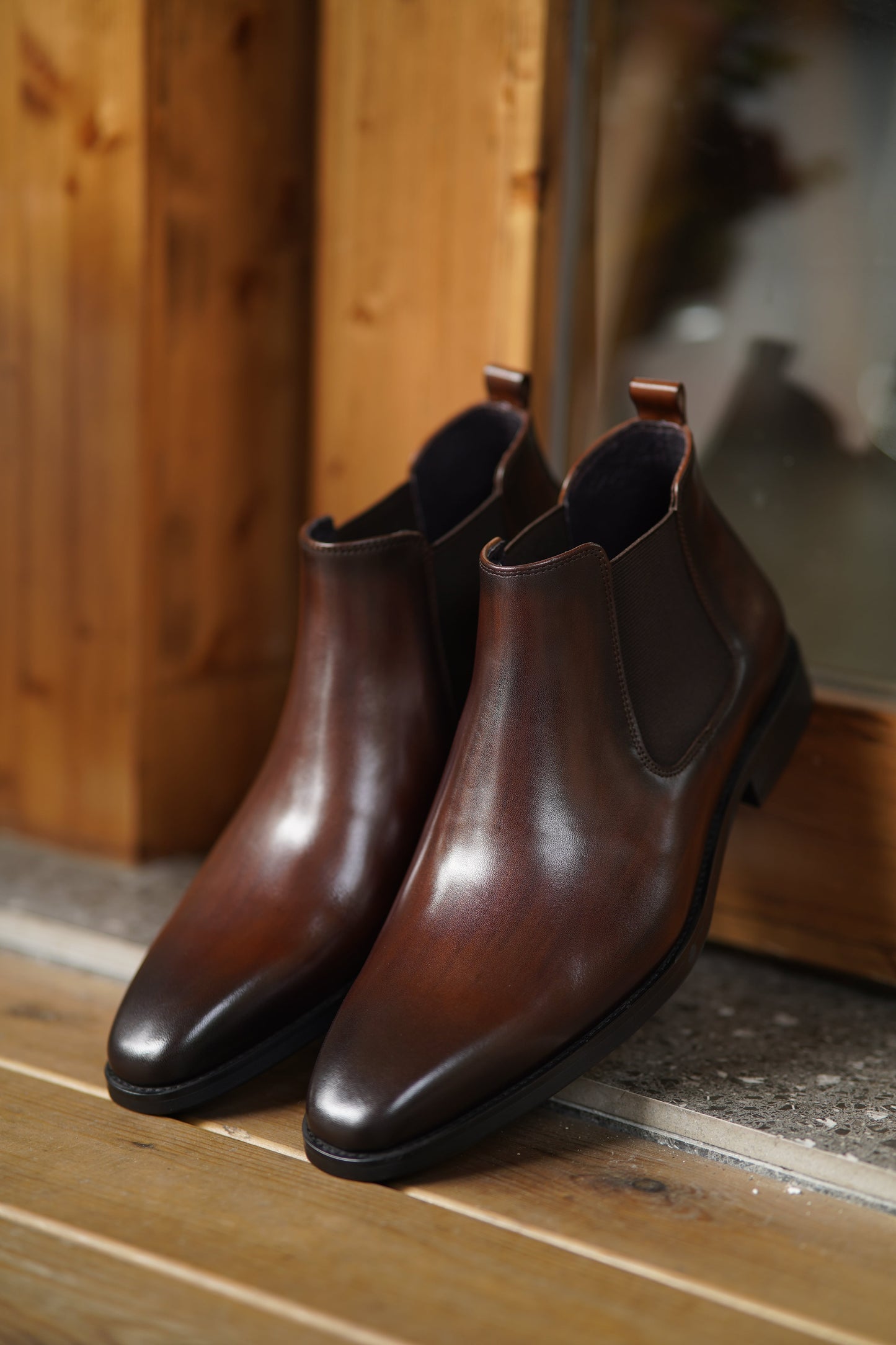 Espresso Majesty Chelsea Boots in polished espresso brown leather, featuring elastic side panels for a refined and comfortable fit.