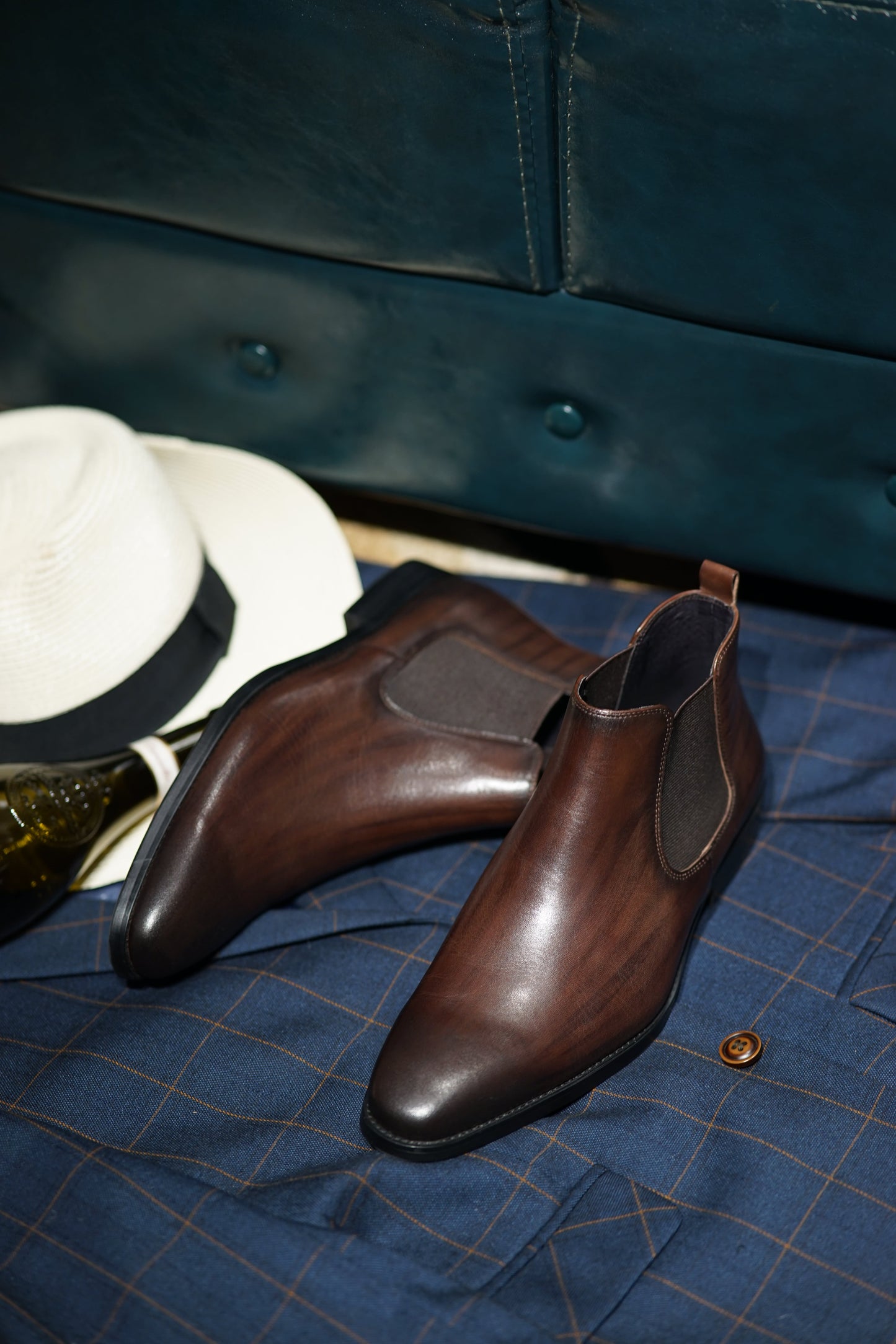 Espresso Majesty Chelsea Boots in polished espresso brown leather, featuring elastic side panels for a refined and comfortable fit.