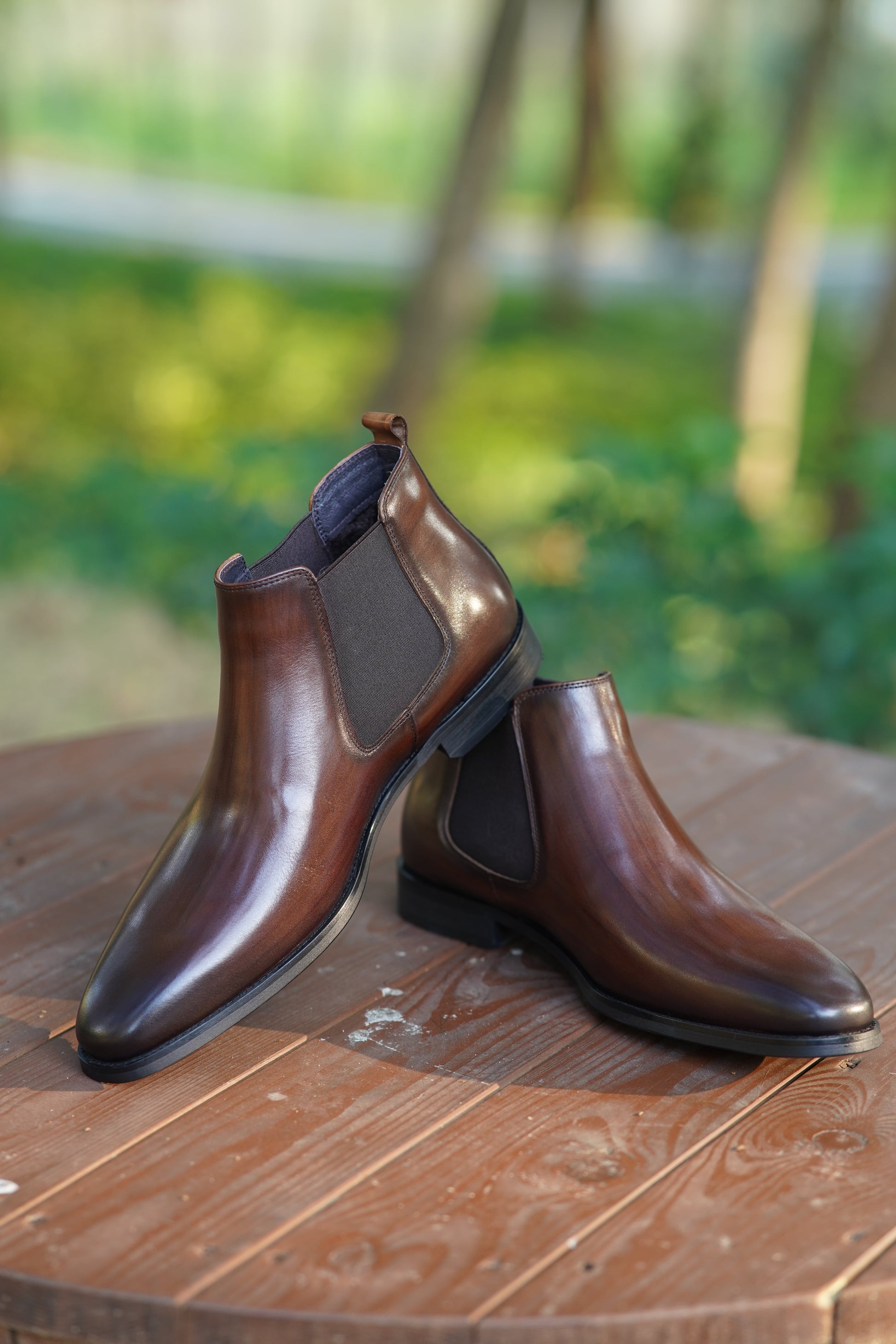 Espresso Majesty Chelsea Boots in polished espresso brown leather, featuring elastic side panels for a refined and comfortable fit.