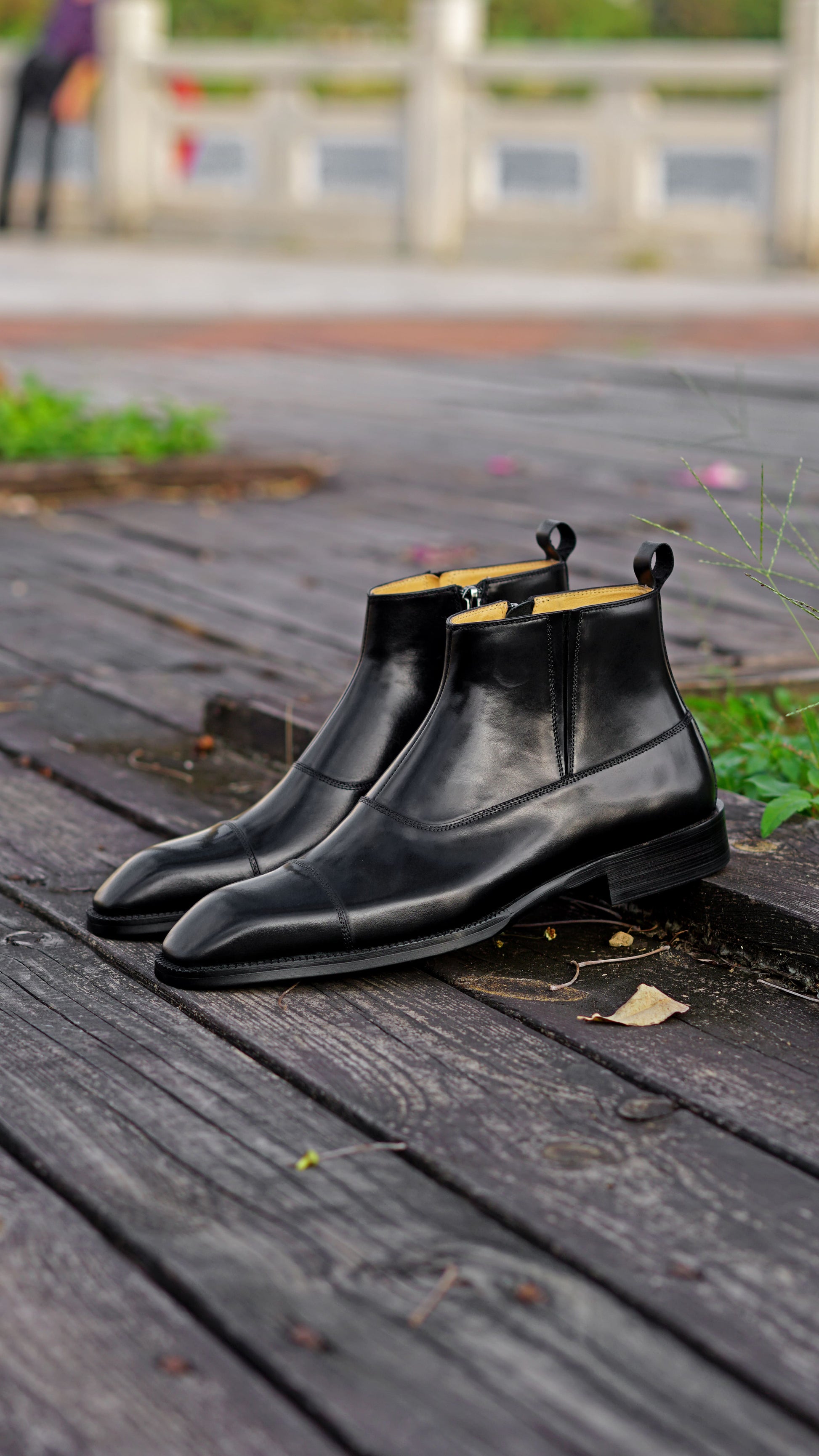 Midnight Gloss Chelsea Boots in high-gloss black leather, featuring elastic side panels for a sleek and comfortable fit.