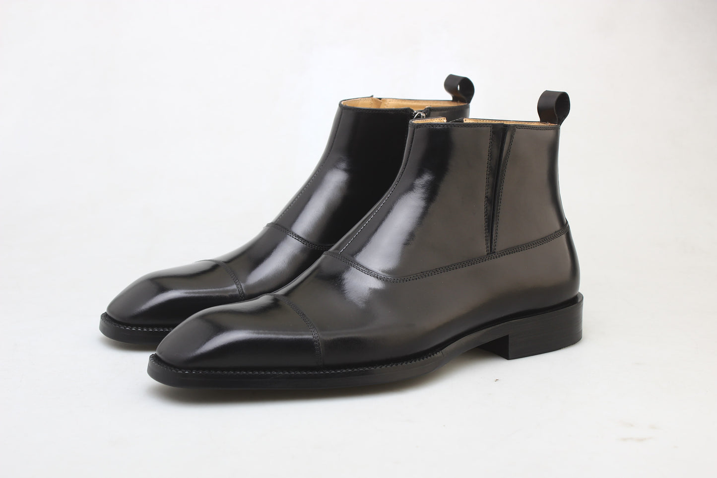 Midnight Gloss Chelsea Boots in high-gloss black leather, featuring elastic side panels for a sleek and comfortable fit.