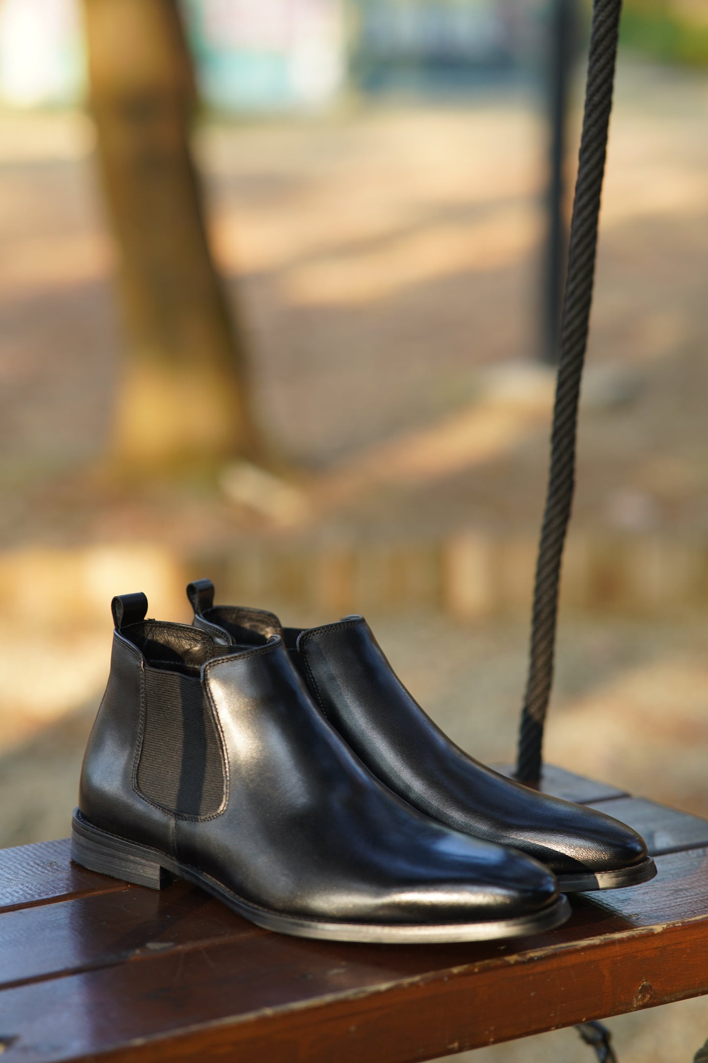 Jet Black Classic Chelsea Boots with high-gloss leather finish and elastic side panels for a sleek, polished look.