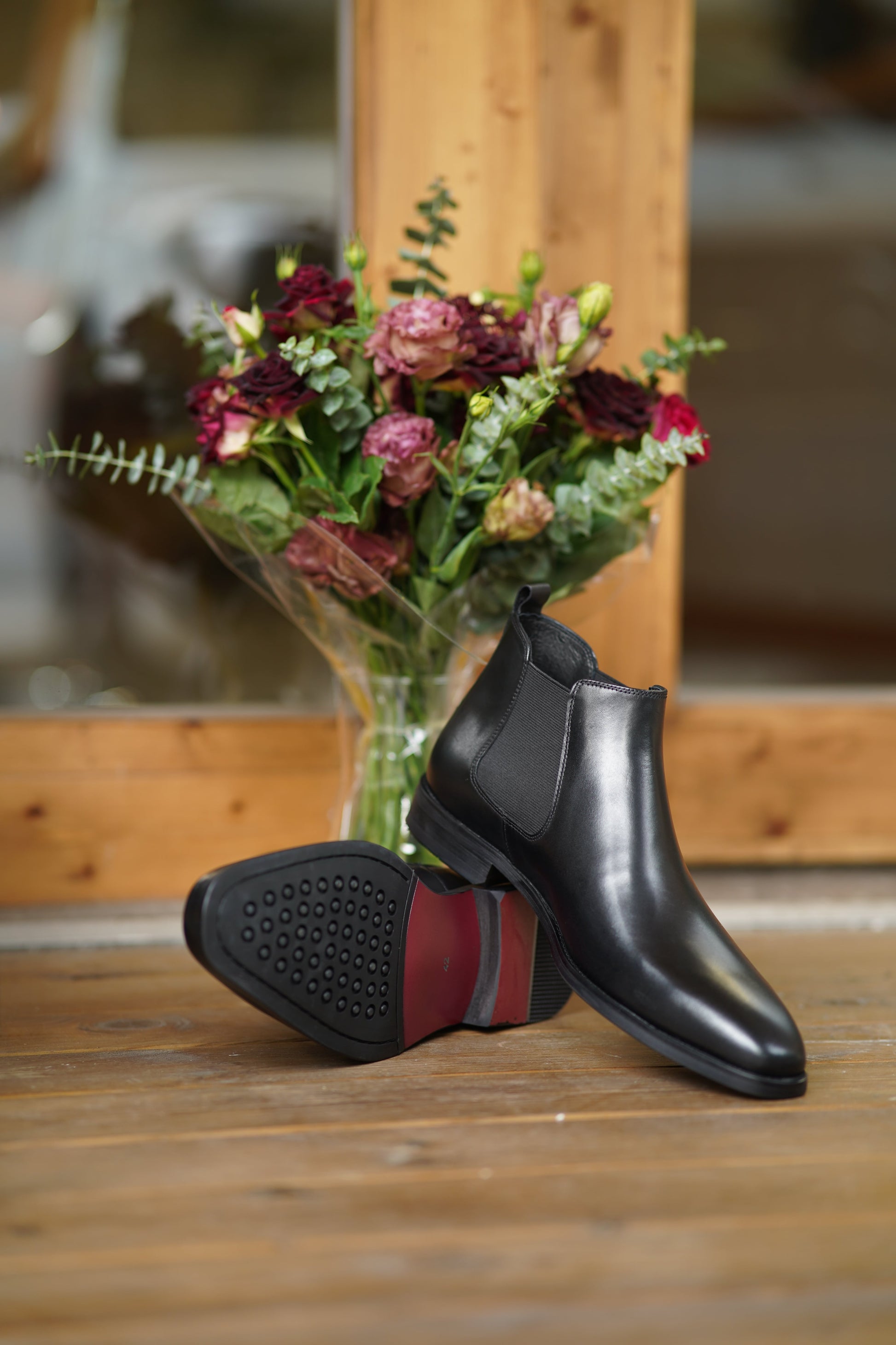 Jet Black Classic Chelsea Boots with high-gloss leather finish and elastic side panels for a sleek, polished look.