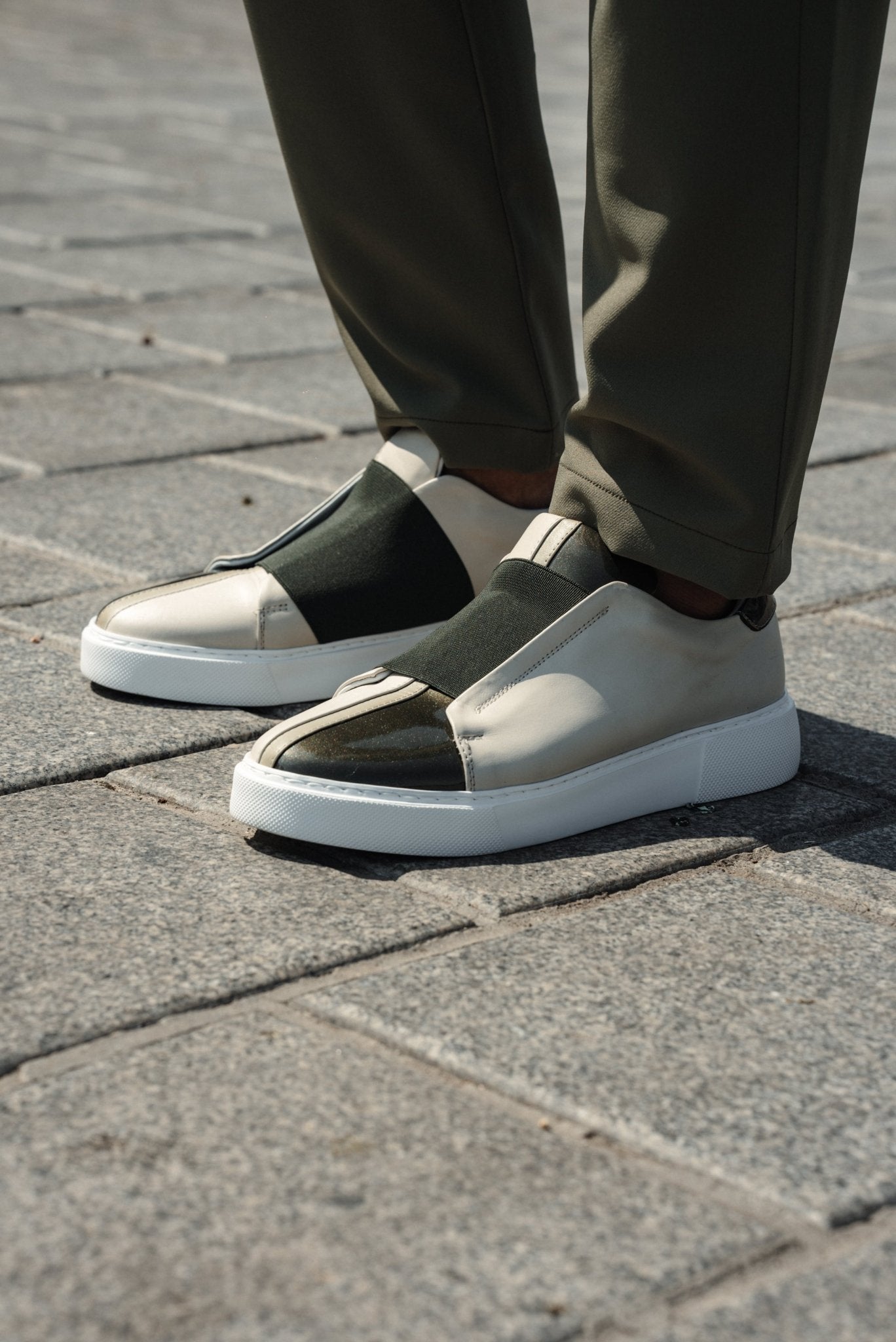 A Beige & Khaki Sneakers on Display. 