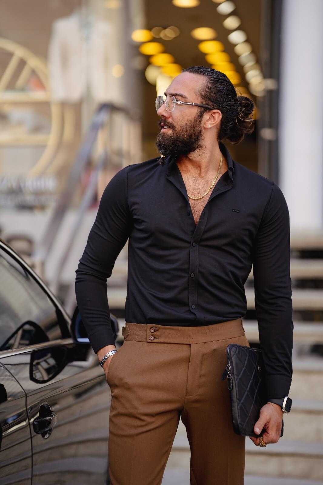 A Black Lycra Long Sleeve Shirt on display.