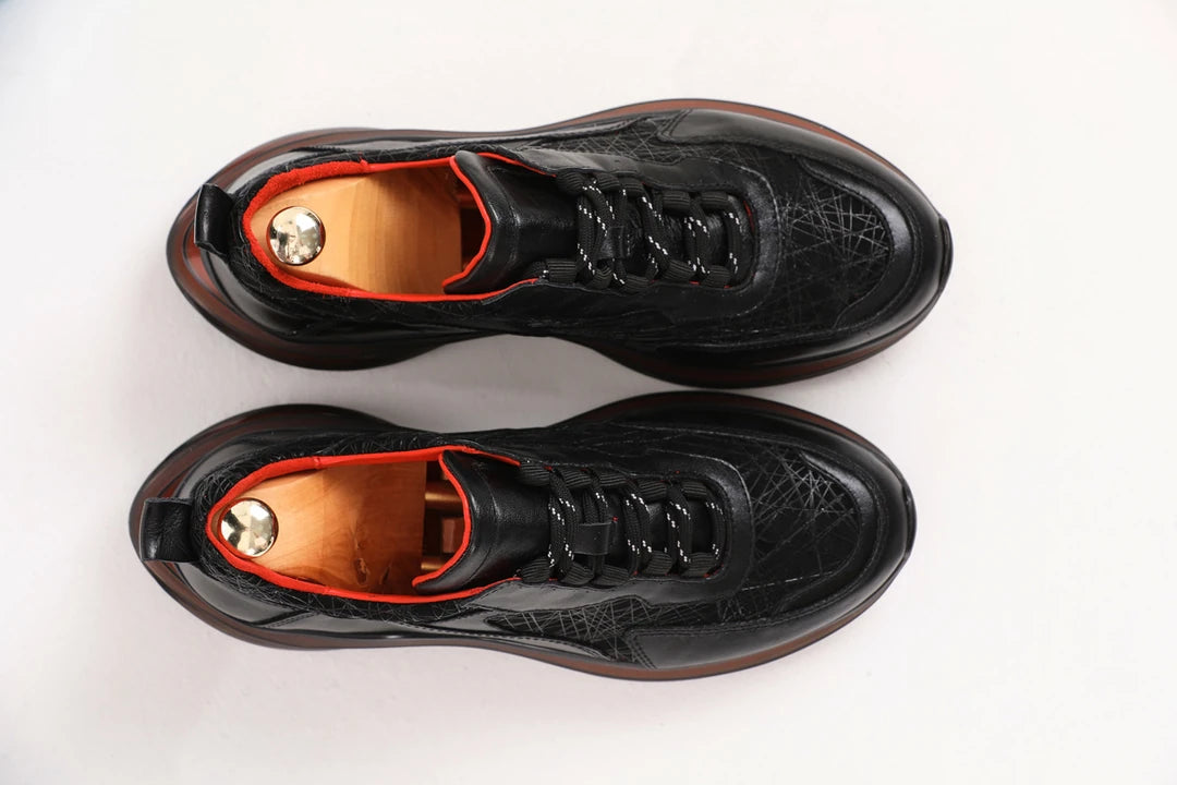 Midnight Raven Luxe Sneaker with premium black leather and red sole accents for men