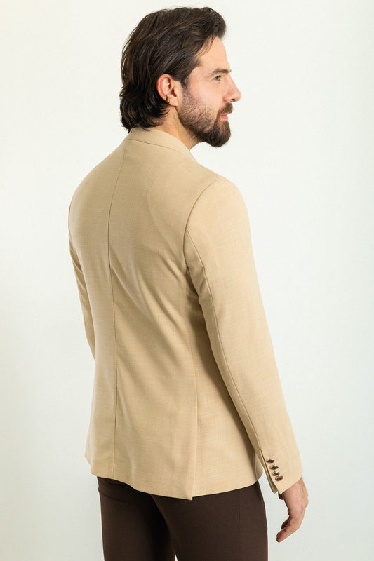 Model wearing a beige double-breasted blazer from HolloMen, perfect for adding sophistication to any outfit.