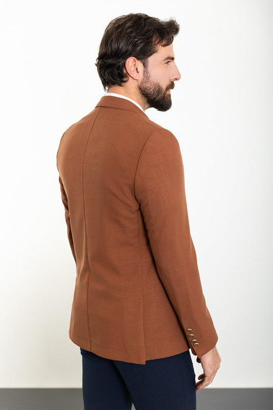 Model showcasing a stylish brown blazer from HolloMen, perfect for adding a touch of elegance to both formal and casual outfits.