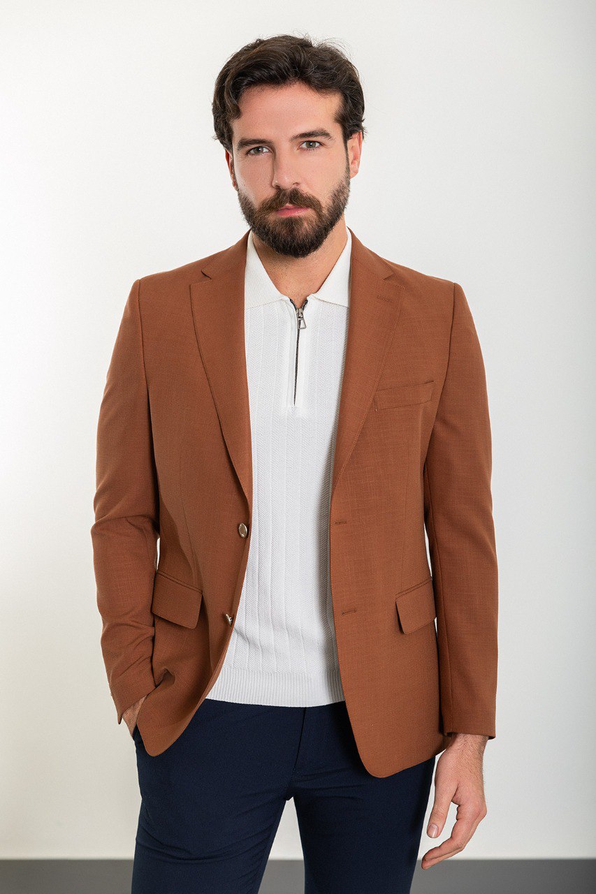 Model showcasing a stylish brown blazer from HolloMen, perfect for adding a touch of elegance to both formal and casual outfits.