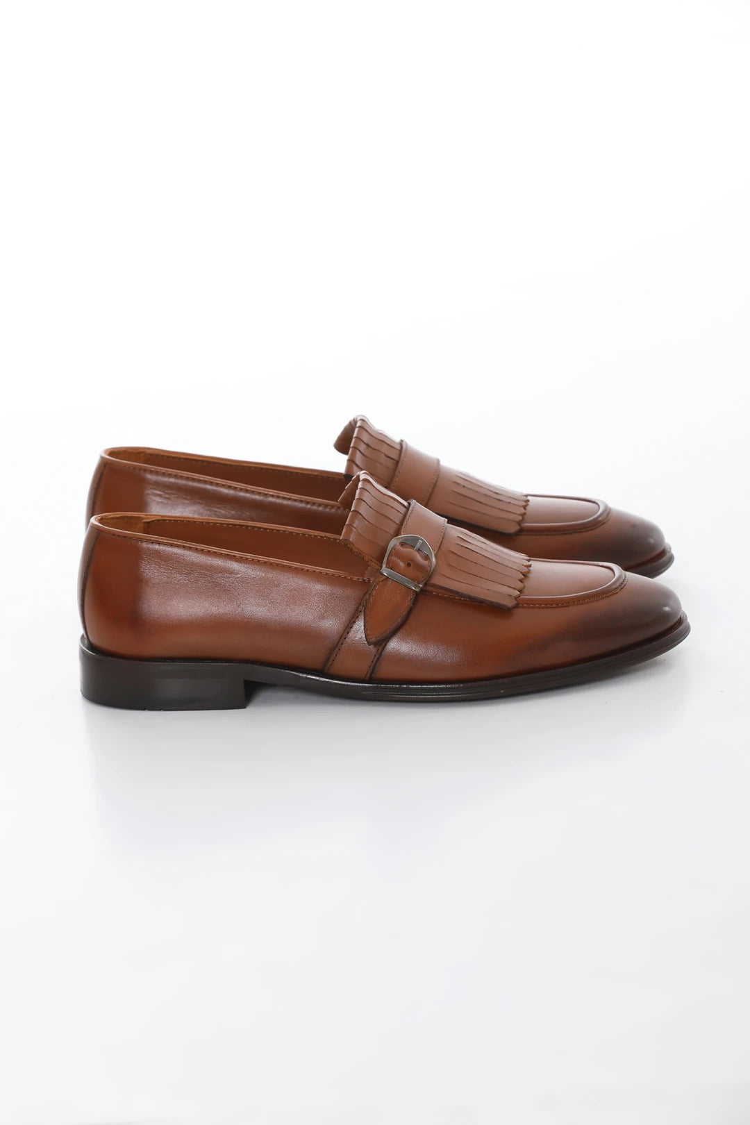 Brown leather loafers with buckle and tassel, microlight sole for comfort, and genuine leather lining.