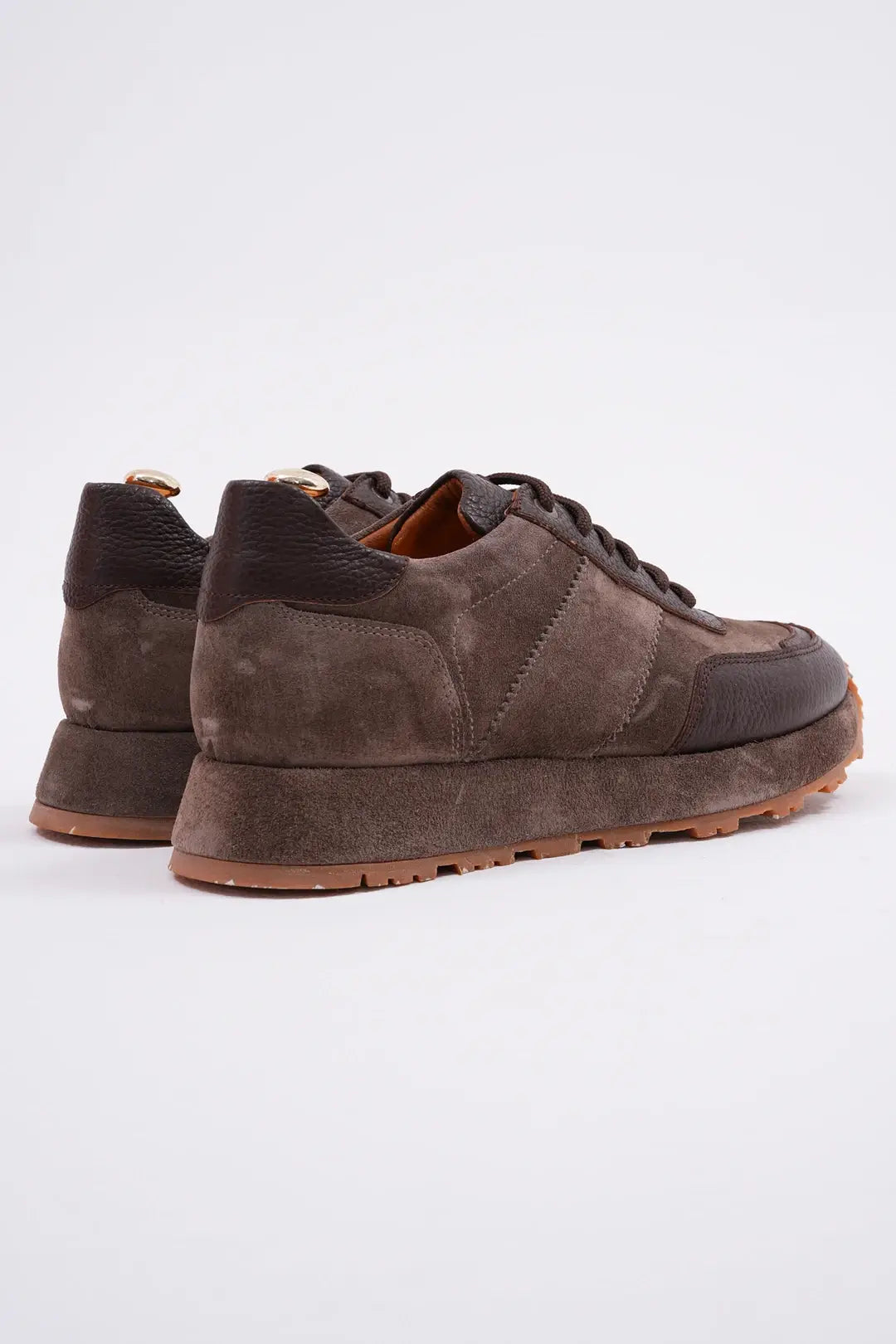 Suede brown leather sneakers with EVA sole, featuring genuine leather lining and rugged detailing.