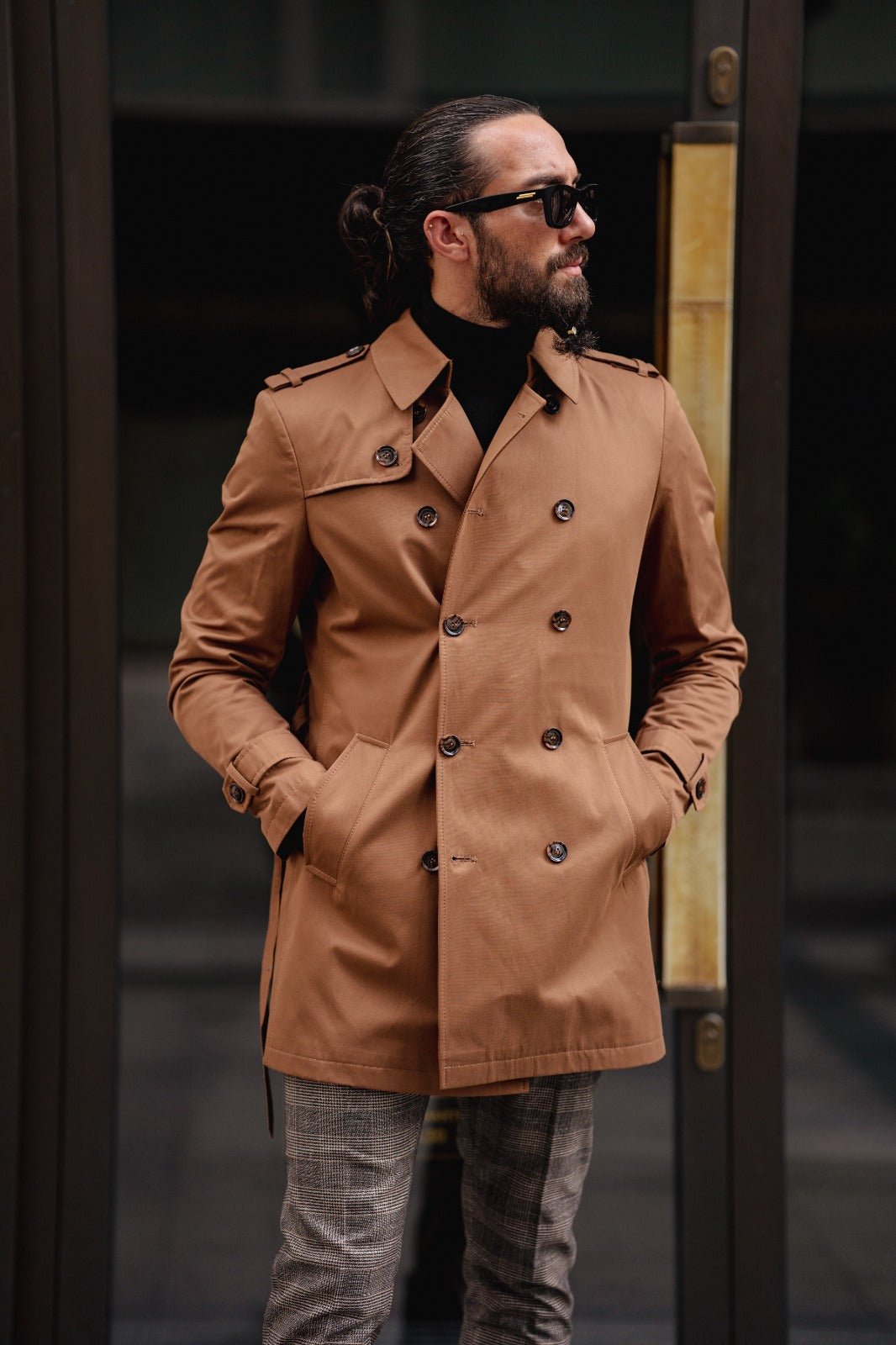 A Camel Trench Coat on display.