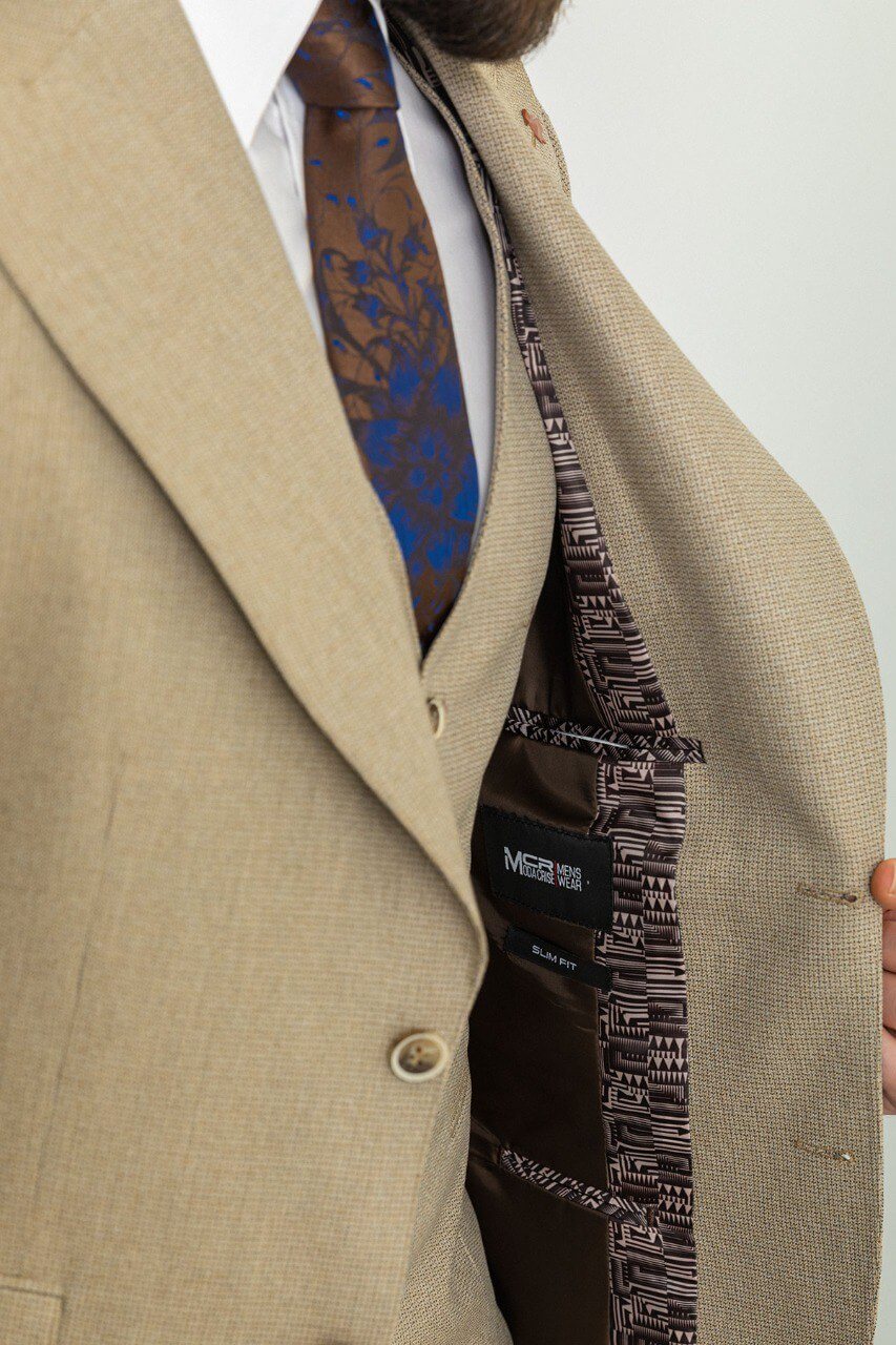 A Classic Beige 3-Piece Suit on Display. 