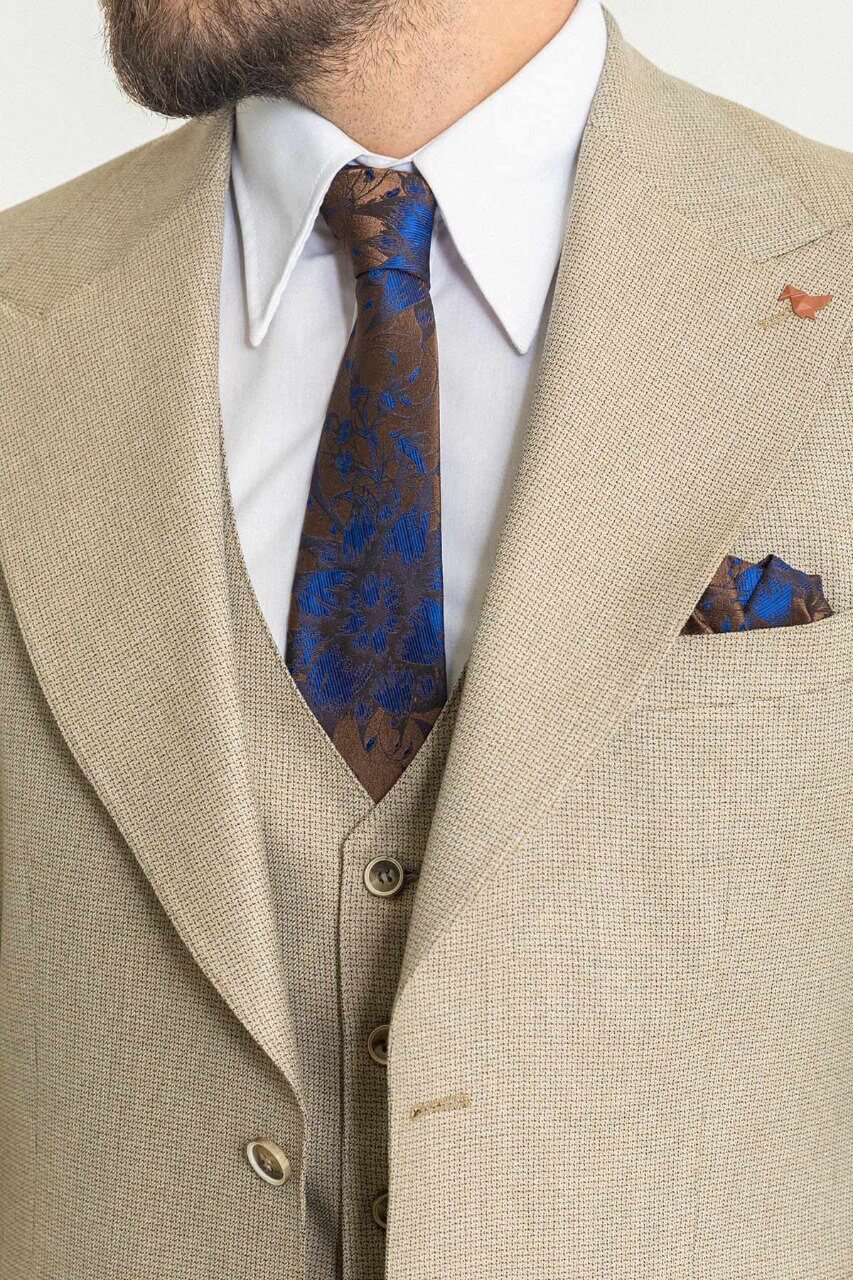 A Classic Beige 3-Piece Suit on Display. 