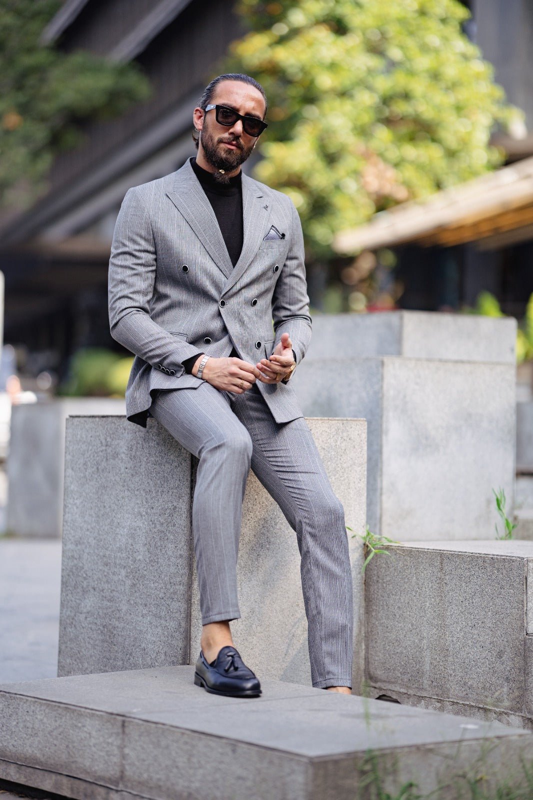 A Gray Slim Fit Double Breasted Suit on display.