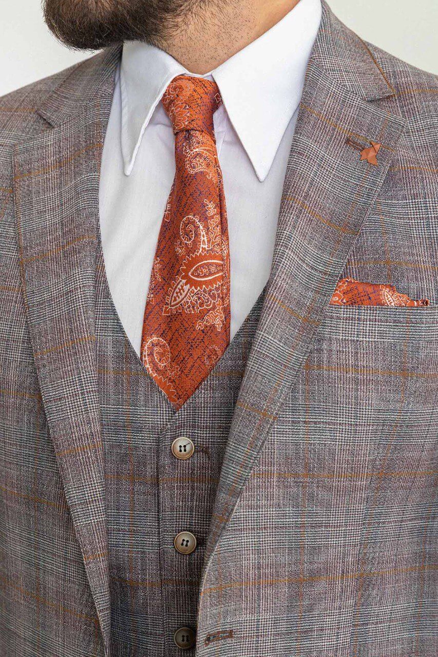 A Gray Orange Suit n Display. 