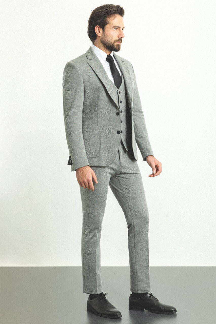 A  Gray 3-Piece Suit on Display. 