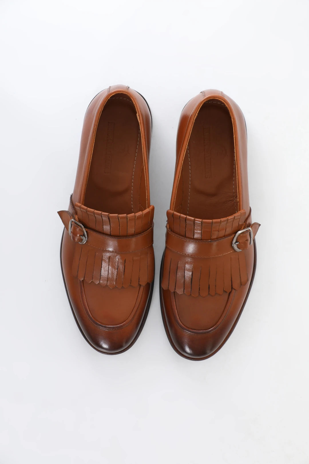 Brown leather loafers with buckle and tassel, microlight sole for comfort, and genuine leather lining.