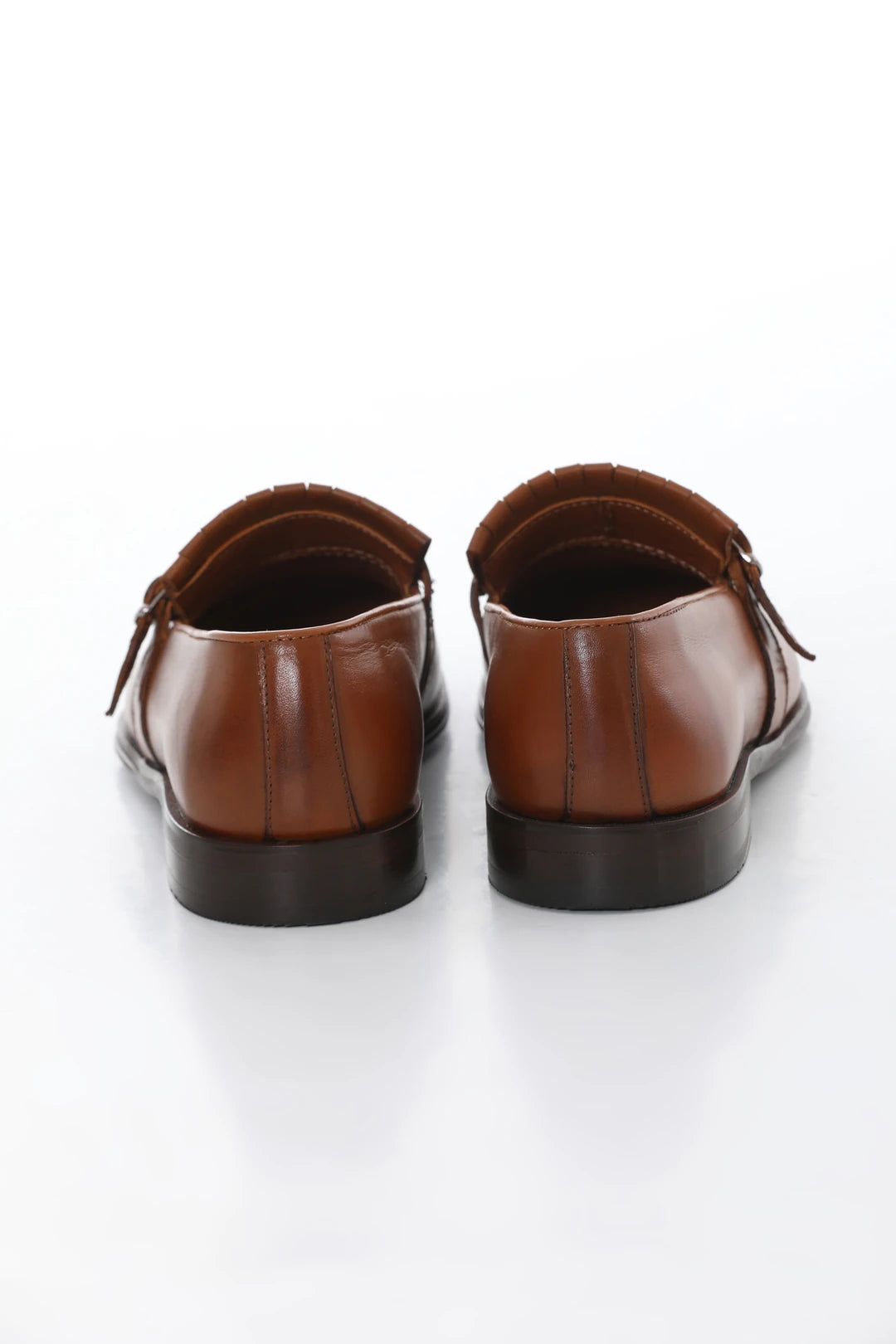 Brown leather loafers with buckle and tassel, microlight sole for comfort, and genuine leather lining.