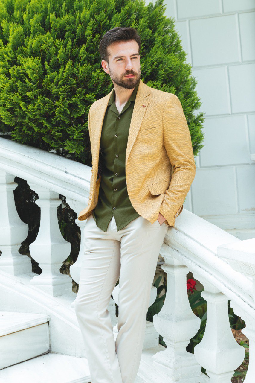 Close-up of a yellow textured blazer from HolloMen, showcasing modern elegance and bold style.