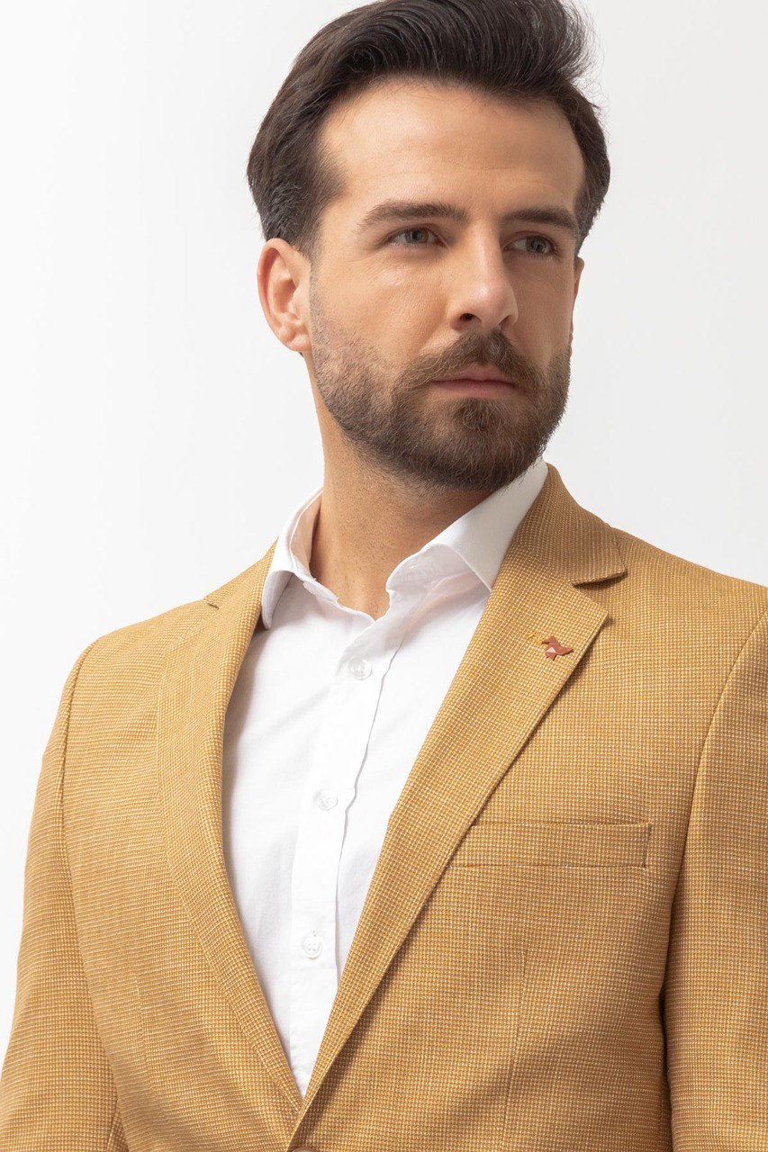 Close-up of a yellow textured blazer from HolloMen, showcasing modern elegance and bold style.