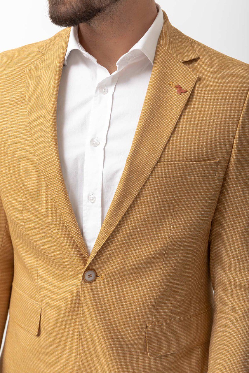 Close-up of a yellow textured blazer from HolloMen, showcasing modern elegance and bold style.