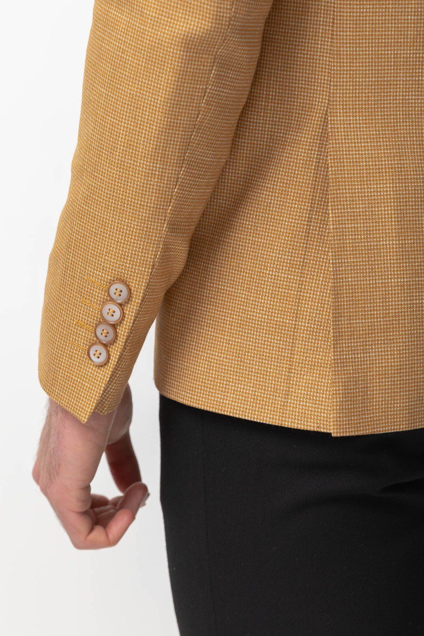 Close-up of a yellow textured blazer from HolloMen, showcasing modern elegance and bold style.