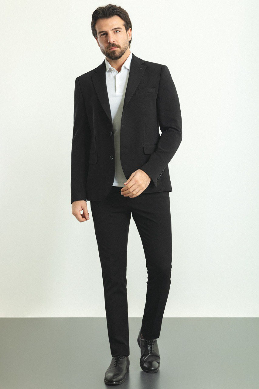 Model wearing a sleek and versatile Black Blazer from HolloMen, perfect for both formal and casual occasions.