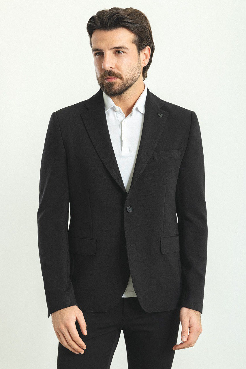 Model wearing a sleek and versatile Black Blazer from HolloMen, perfect for both formal and casual occasions.