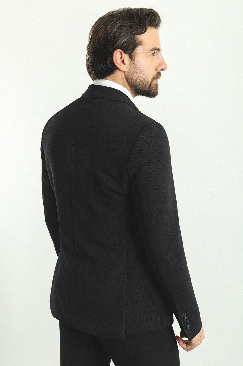 Model wearing a sleek and versatile Black Blazer from HolloMen, perfect for both formal and casual occasions.