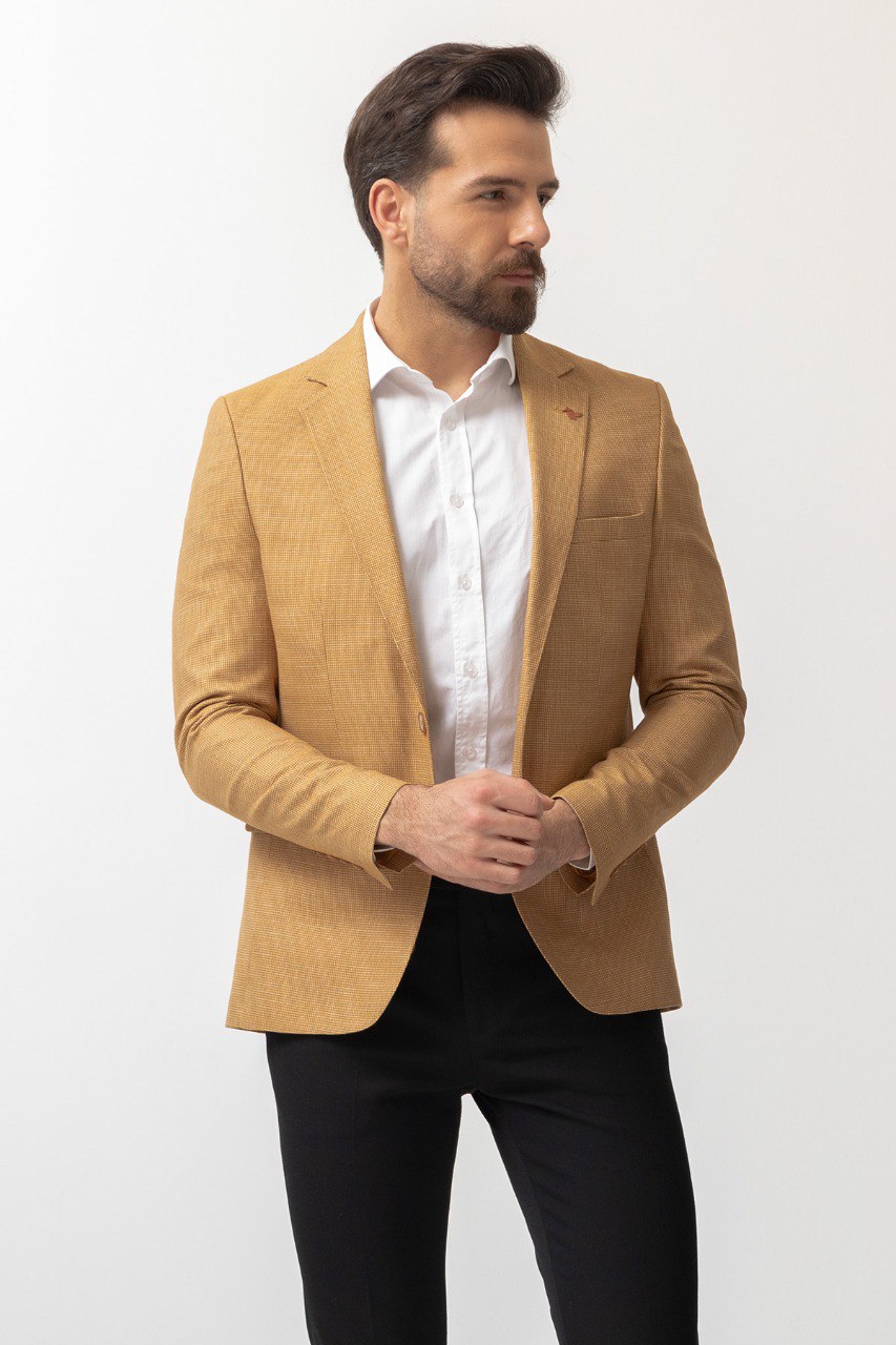 Close-up of a yellow textured blazer from HolloMen, showcasing modern elegance and bold style.