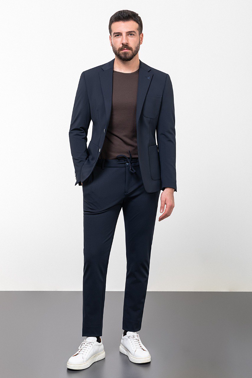 Man wearing a navy blue casual suit, blending modern style with comfort for effortless sophistication.