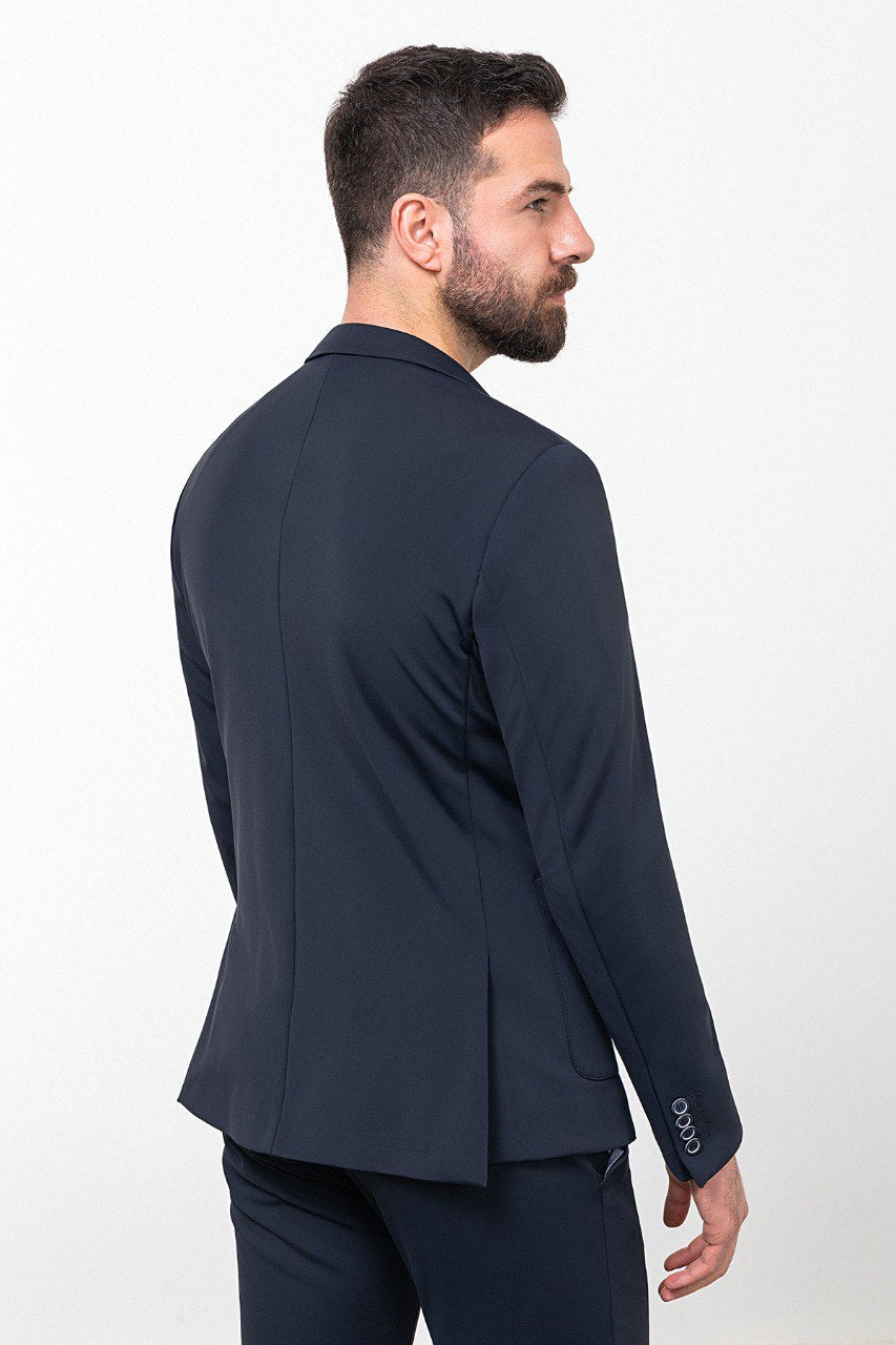 Man wearing a navy blue casual suit, blending modern style with comfort for effortless sophistication.