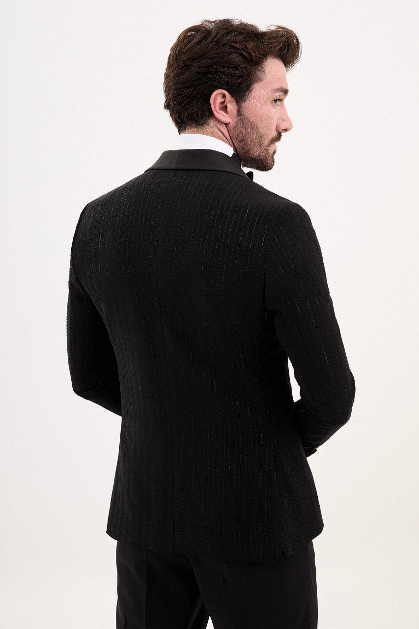 Model wearing a double-breasted black suit from HolloMen’s Spring Summer Collection, showcasing sleek and sophisticated tailoring.