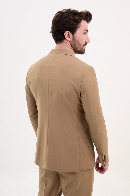 Man wearing a double-breasted camel suit from HolloMen’s Spring Summer Collection, paired with a casual brown shirt.