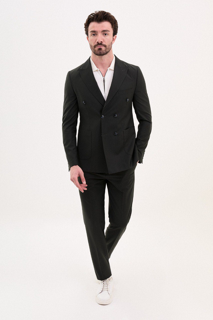 Man wearing a double-breasted black casual suit with white sneakers from HolloMen's Spring Summer Collection.