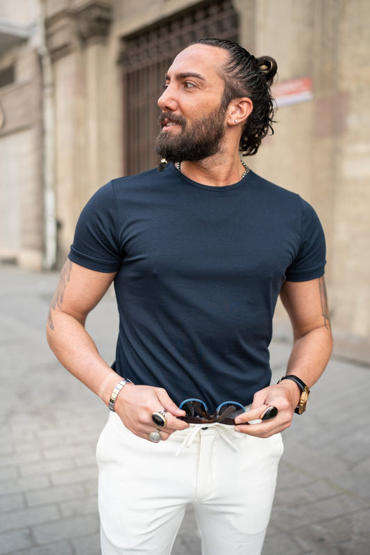 A Navy blue T-shirt worn by a model