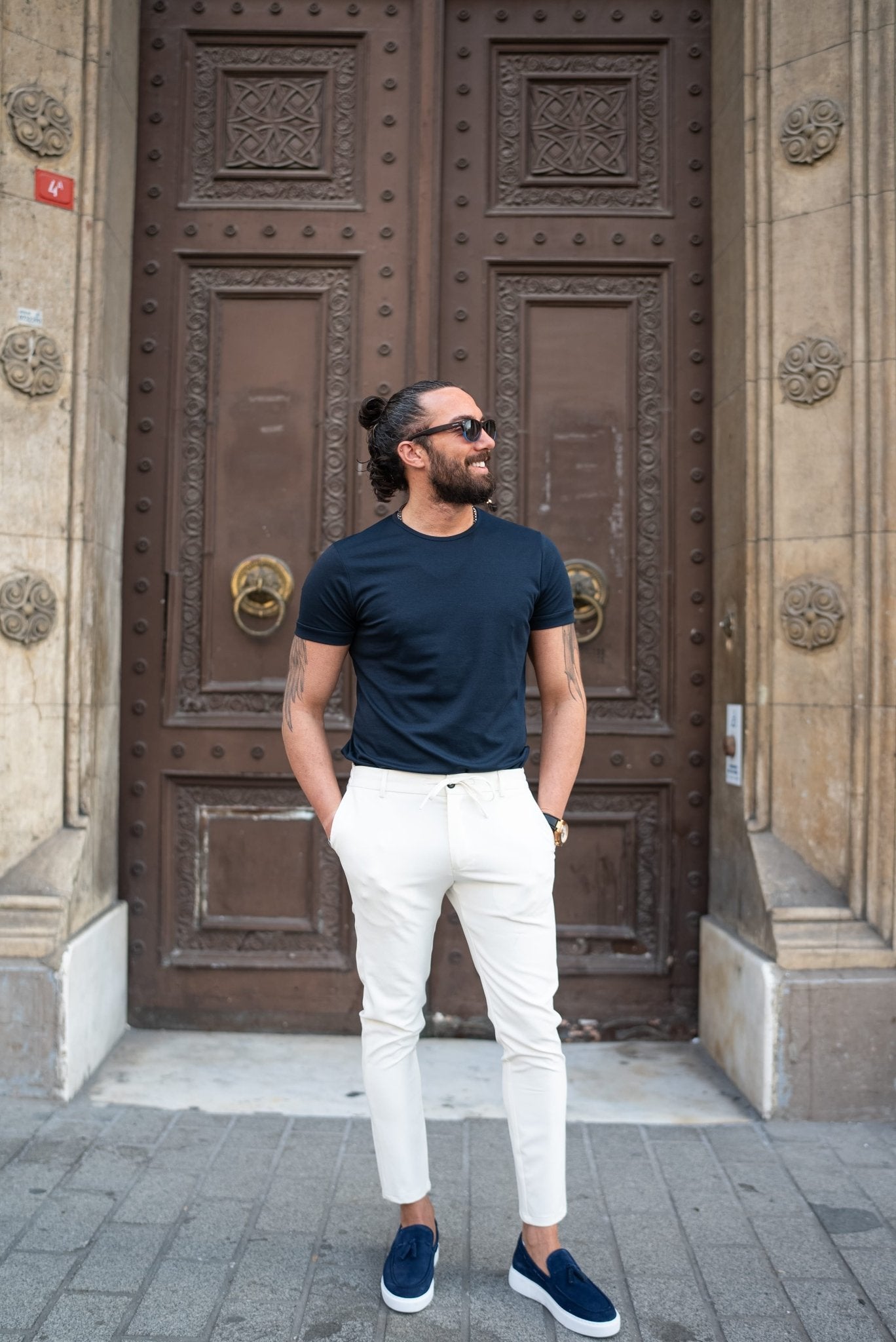 A Navy blue T-shirt worn by a model