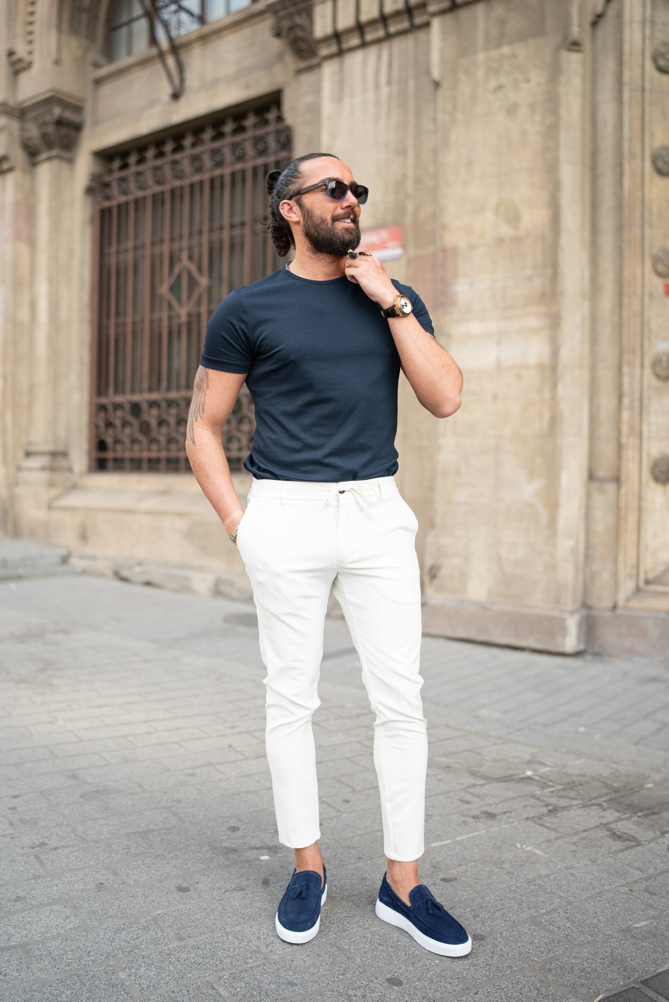 A Navy blue T-shirt worn by a model