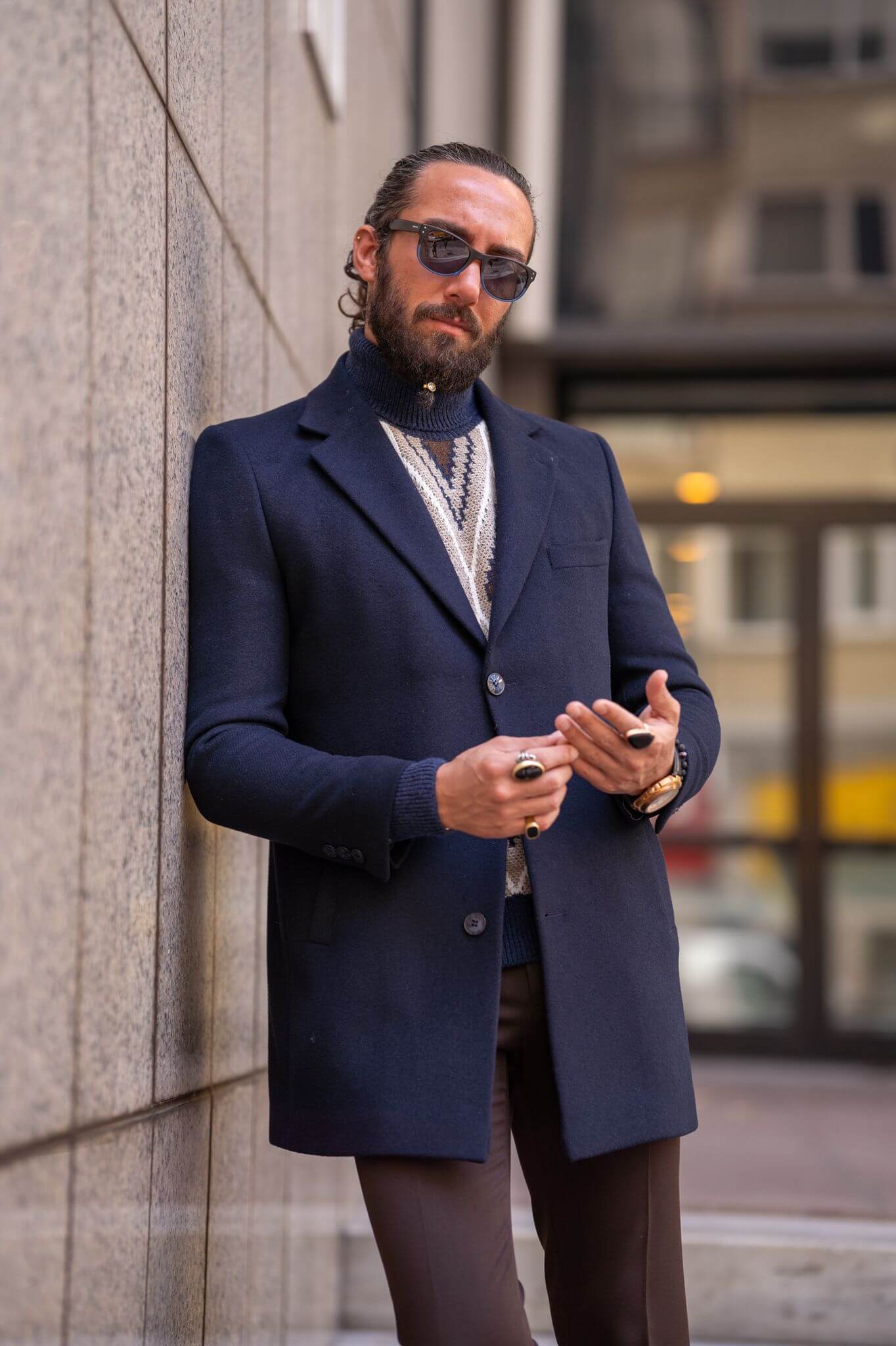 Striking male model confidently presents our latest fashion statement: the Navy Blue Coat,