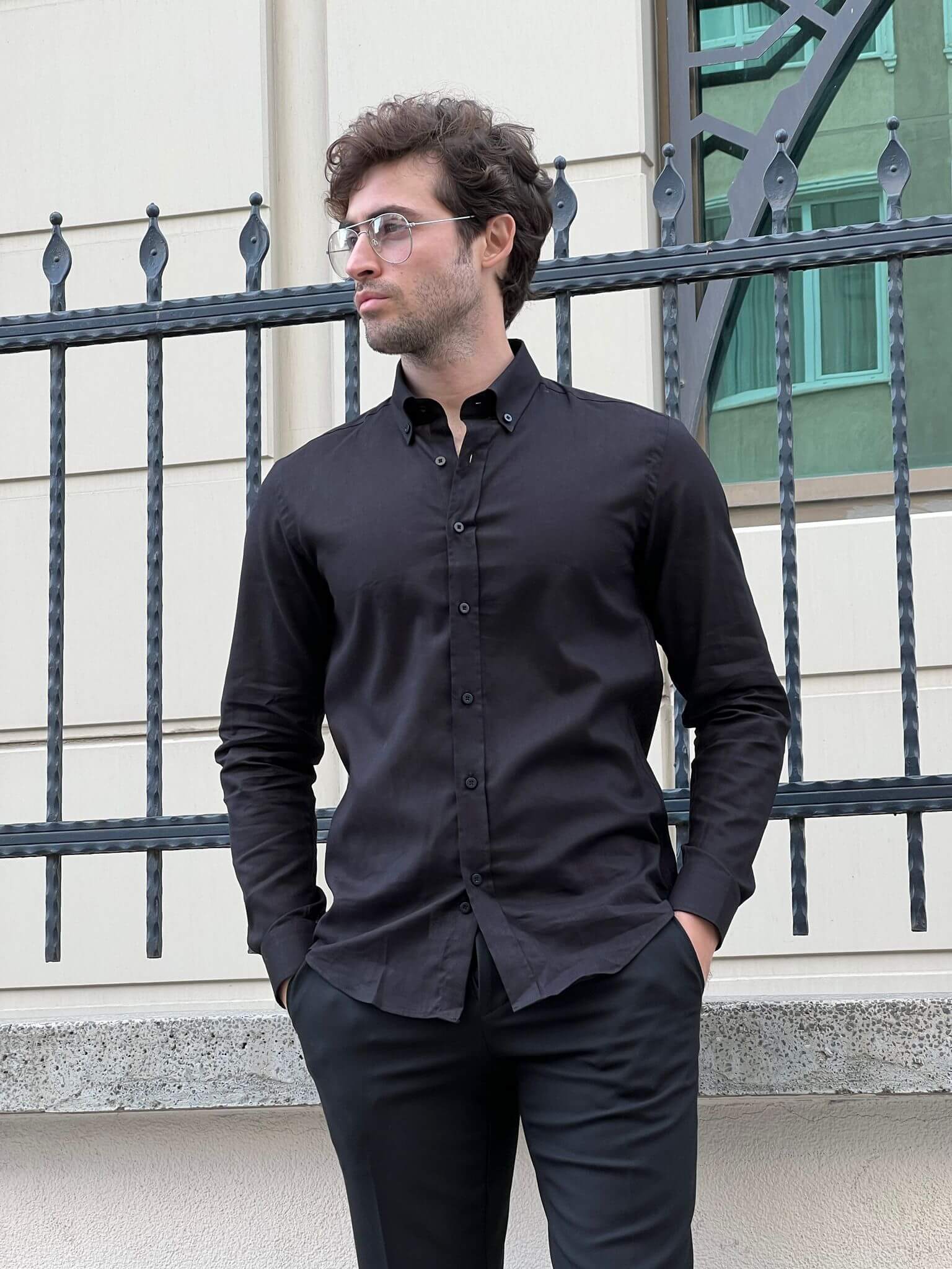 Captivating image of a male model in a black cotton shirt, highlighting comfort and elegance.