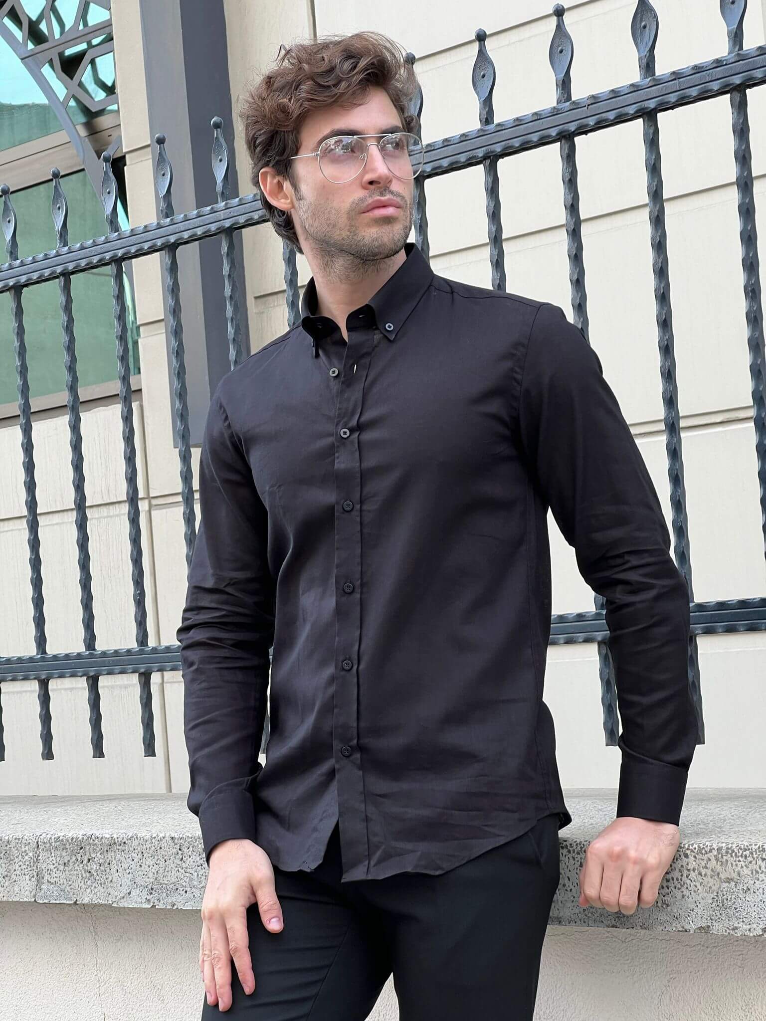 Captivating image of a male model in a black cotton shirt, highlighting comfort and elegance.