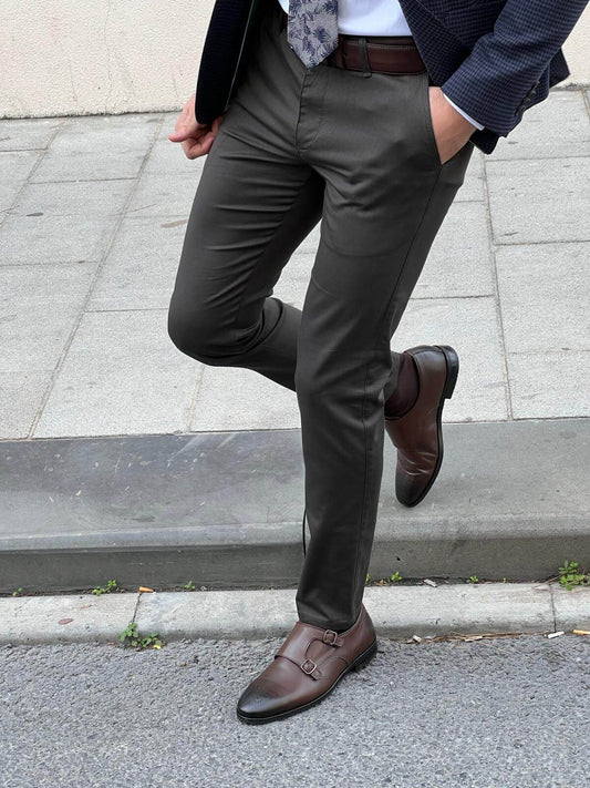 Stylish male model confidently presenting classic khaki pants with a modern twist, exuding sophistication and versatility in fashion.